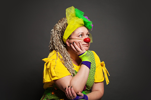 Woman clown dreaming portrait. Performance Actress at work