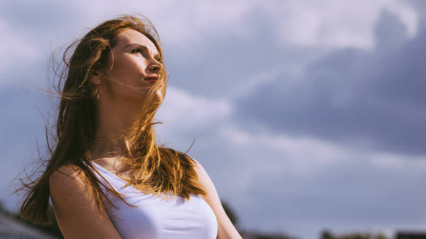 istock Girl relaxing outdoor enjoying sunlight 1200166087