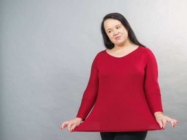 istock Woman plus size in red tunic 1200166520