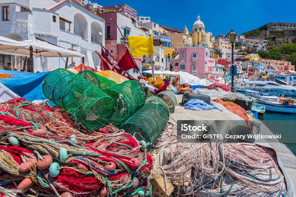 Pretty fishing village, colourful fishermen's houses, and fishing nets, Marina Corricella Procida Island, Bay of Naples, Italy. Procida Island Stock Photo