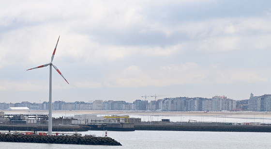 Belgium seems to have more windmills than people, here we enter the Zeebruge harbor with a windmill and the city skyline in the background