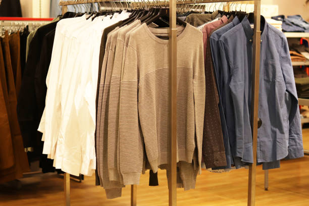 istock men's clothes on hangers in a store 1200174250