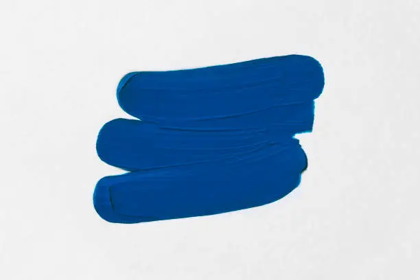 Photo of Smears of oil paint. Color of the year 2020 - Classic Blue. Color trend palette.