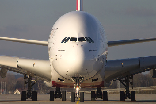 Munich, Germany - January 6, 2018: Emirates Airbus A380 airplane tail at Munich airport (MUC) in Germany. Airbus is an aircraft manufacturer from Toulouse, France.