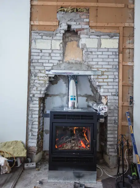 Photo of Home improvement in progress after the removal of an obsolete fireplace.