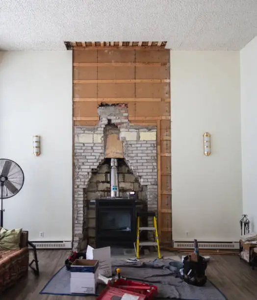 Photo of Home improvement in progress after the removal of an obsolete fireplace.
