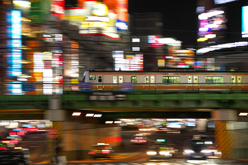 Tokyo,Japan-January 13, 2020: Panning of elevated train running at the north of Shinjuku station in Tokyo