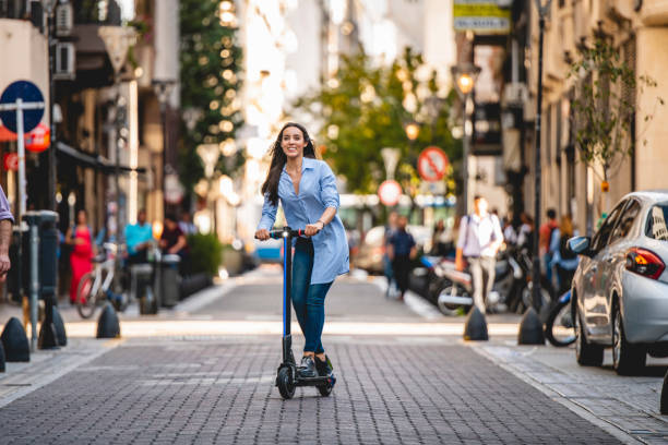 istock Independent Vacationer Exploring on Electric Push Scooter 1200182819