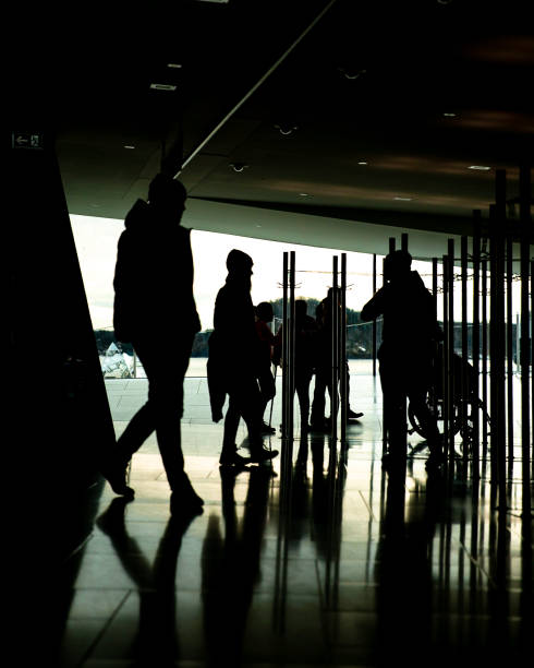 istock Oslo opera cloakroom silhouettes 1200184167