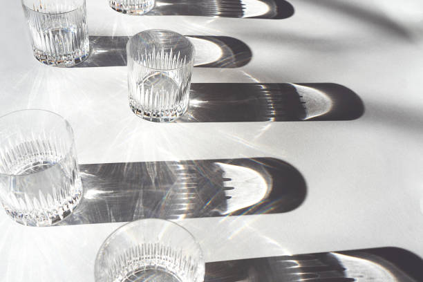 istock Trendy pattern made with glasses and shadows on gray white background. 1200184179