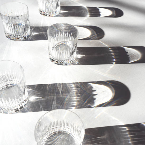 istock Trendy pattern made with glasses and shadows on gray white background. 1200184182