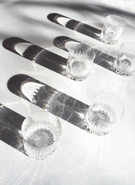 istock Trendy pattern made with glasses and shadows on gray white background. 1200184252