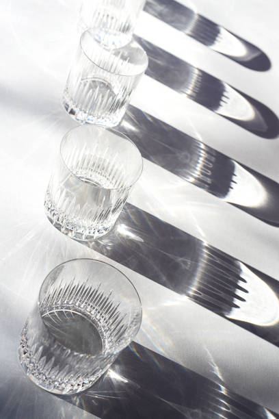 istock Trendy pattern made with glasses and shadows on gray white background. 1200184253