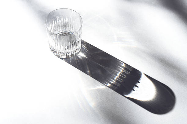 istock Trendy pattern made with glasses and shadows on gray white background. 1200184478