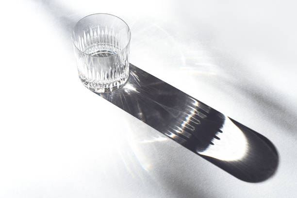 istock Trendy pattern made with glasses and shadows on gray white background. 1200184484