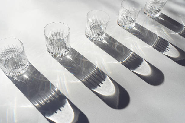 istock Trendy pattern made with glasses and shadows on gray white background. 1200185529