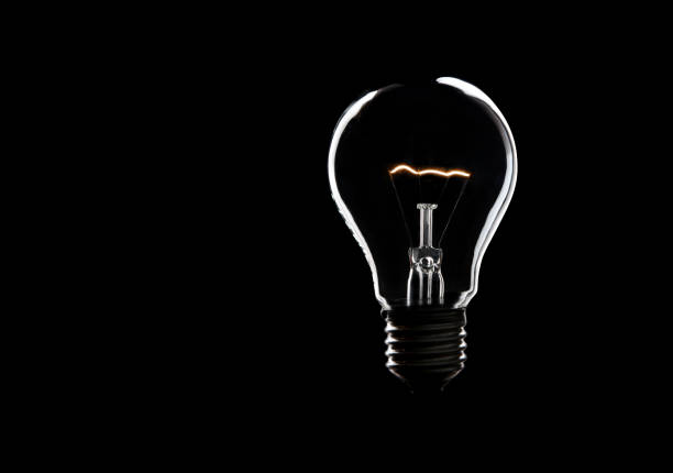 istock Burning light burp. Symbol for bright ideas. Lots of black copy space 1200185861