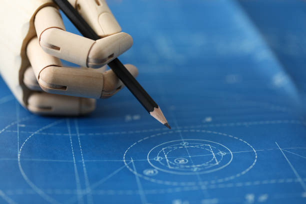 istock Wooden hand hold black pencil against blueprint 1200190496