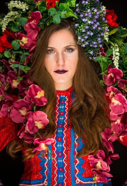 istock young brunette with flowers on her head 1200191907