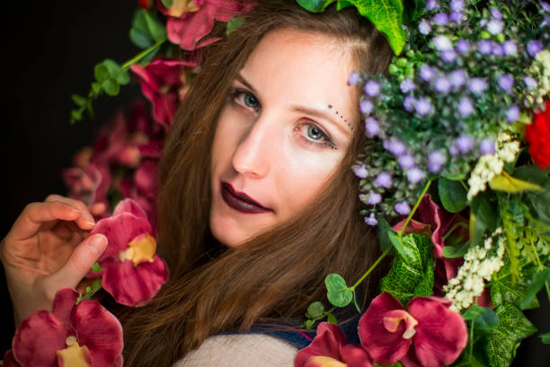 istock young brunette with flowers on her head 1200191909