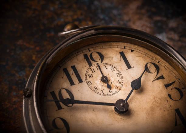istock Old clock vintage close-up macrophotography overhead on rustic  dark background 1200192138