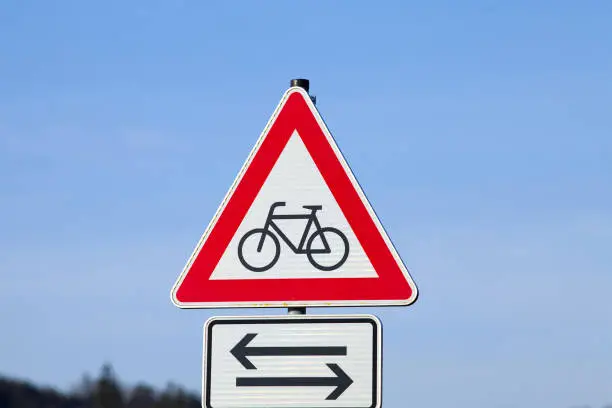 Sign Attention cyclists. Warning of crossing cyclists on the road