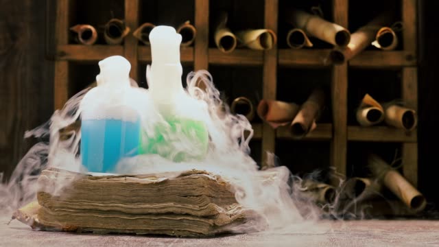 Vintage alchemist laboratory full of medieval and old scrolls