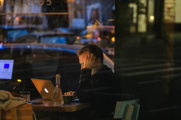 Young man working from a coffee shop in Bucharest, Romania, 2020