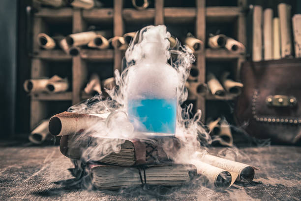 Extraordinary alchemist laboratory with unique scrolls and manuscripts stock photo