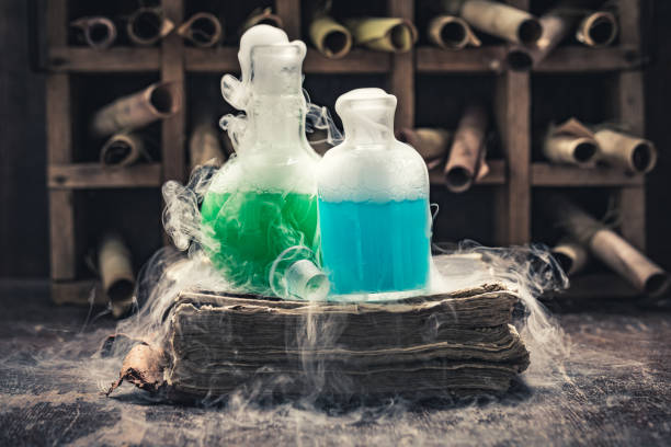 istock Extraordinary alchemist laboratory full of medieval and old scrolls 1200199889