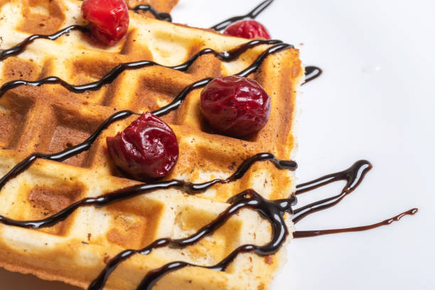 istock Viennese waffles with ice cream, chocolate and cherry. 1200200885