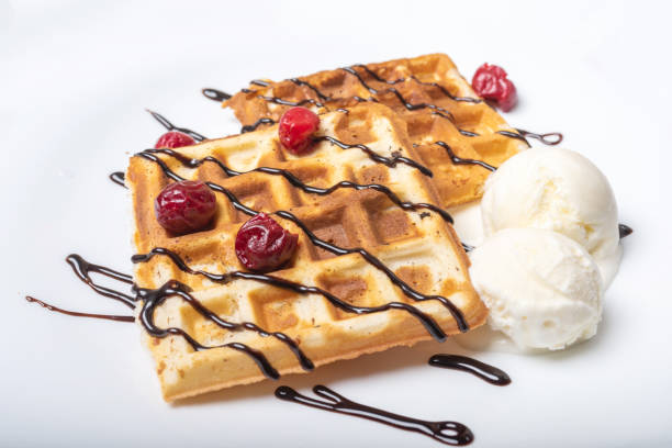 istock Viennese waffles with ice cream, chocolate and cherry. 1200200904