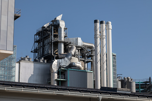 Industrial chimneys and factory rooftop solar power plants