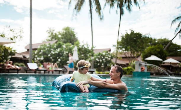 istock Father and son enjoying at the pool 1200202108