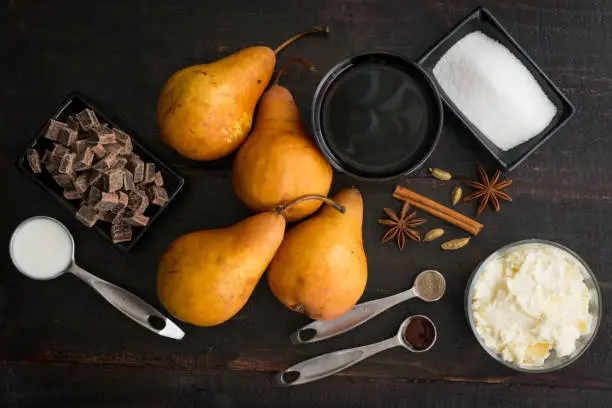 Fresh Bosc pears, mascarpone cheese, and other ingredients used to make pears poached in red wine