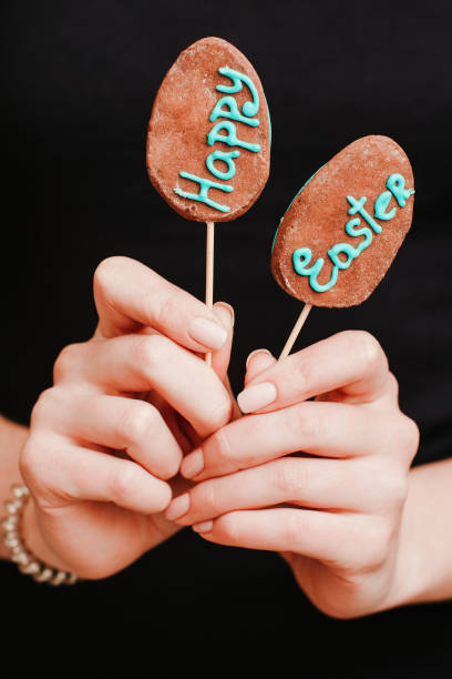 istock happy easter female hands cake pops blue lettering 1200205860