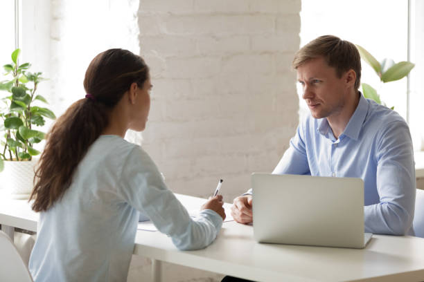 friendly hr manager listening to job applicant on interview. - human resources job search skill teaching imagens e fotografias de stock