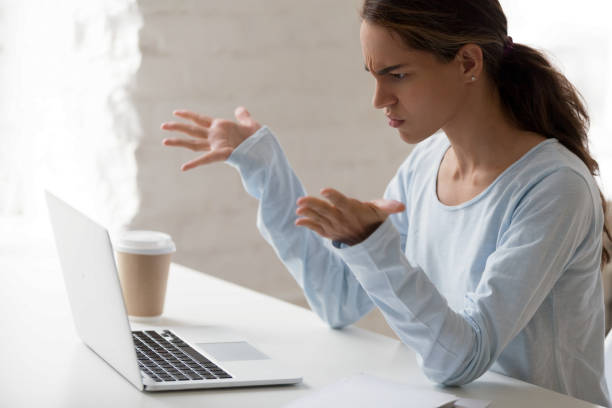 istock Stressed mixed race female employee irritated by bad computer work. 1200214122
