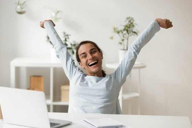 istock Overjoyed smiling young mixed race lady relaxing after finishing project. 1200214135