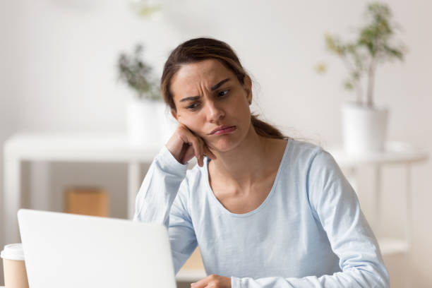 istock Unhappy stressed young mixed race woman stuck with hard task. 1200214140