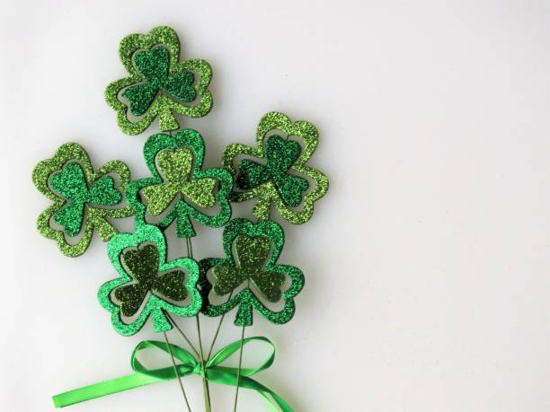 istock Glittery shamrock decoration on White background, St. Patrick's Day, Copy Space 1200215048