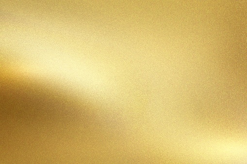 Pared de metal de lámina de oro con luz brillante brillante, fondo de textura abstracta photo