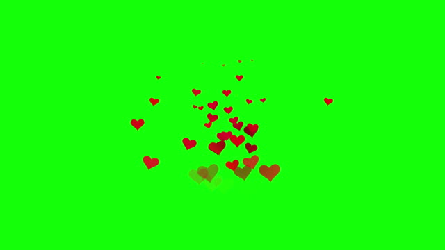 Seamless looping many red hearts particle emotion fade in floating on green screen background. Icon confetti and abstract particle on chroma key for decoration template element. Happy Valentines Day