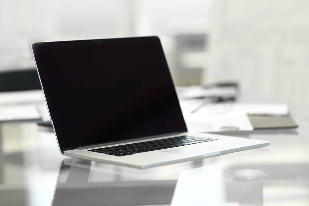 istock close up. open laptop on office Desk . 1200230546