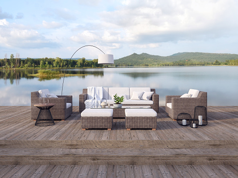 Outdoor terrace living area with beautiful lake and mountain view 3d render