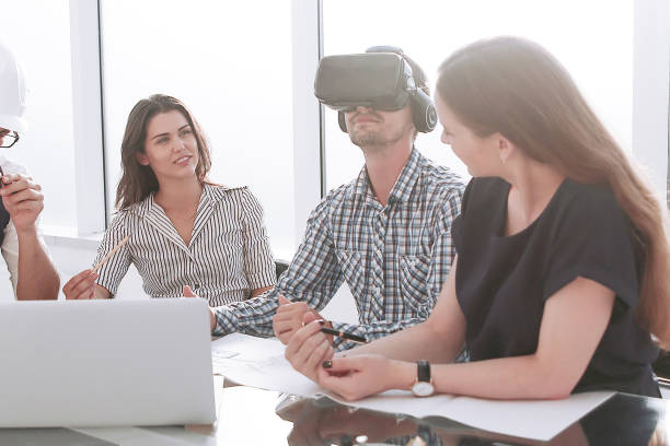 istock engineer in virtual reality glasses at a meeting with the business team 1200236263