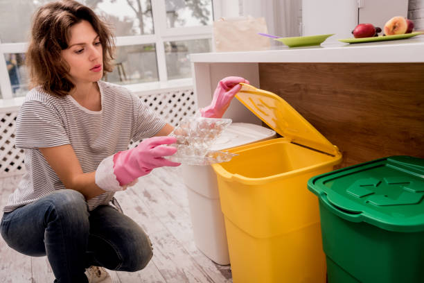 istock Young girl sorting garbage at the kitchen. Concept of recycling. Zero waste 1200237689