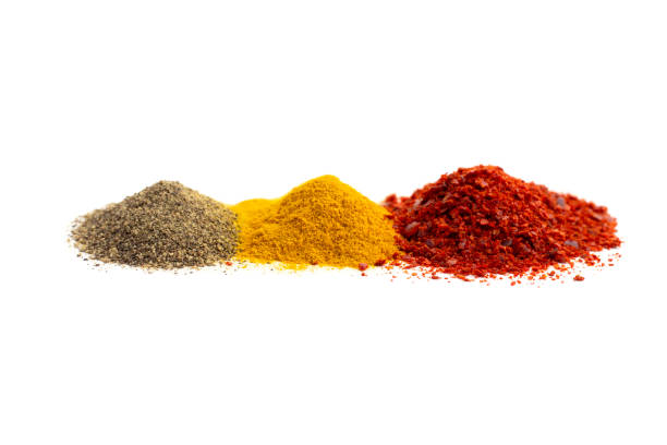 istock Ground red and black pepper and turmeric isolated on white background, front view. 1200243999