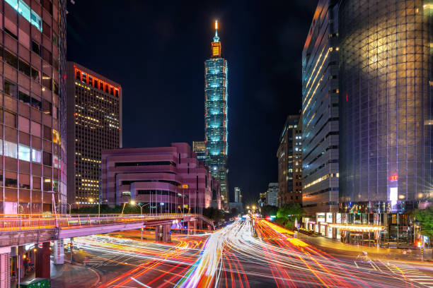 istock Traffic speeds through an intersection at night in Taiwan. 1200259348