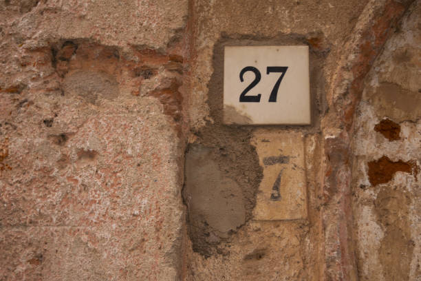 istock old peeling wall with house number 1200259393